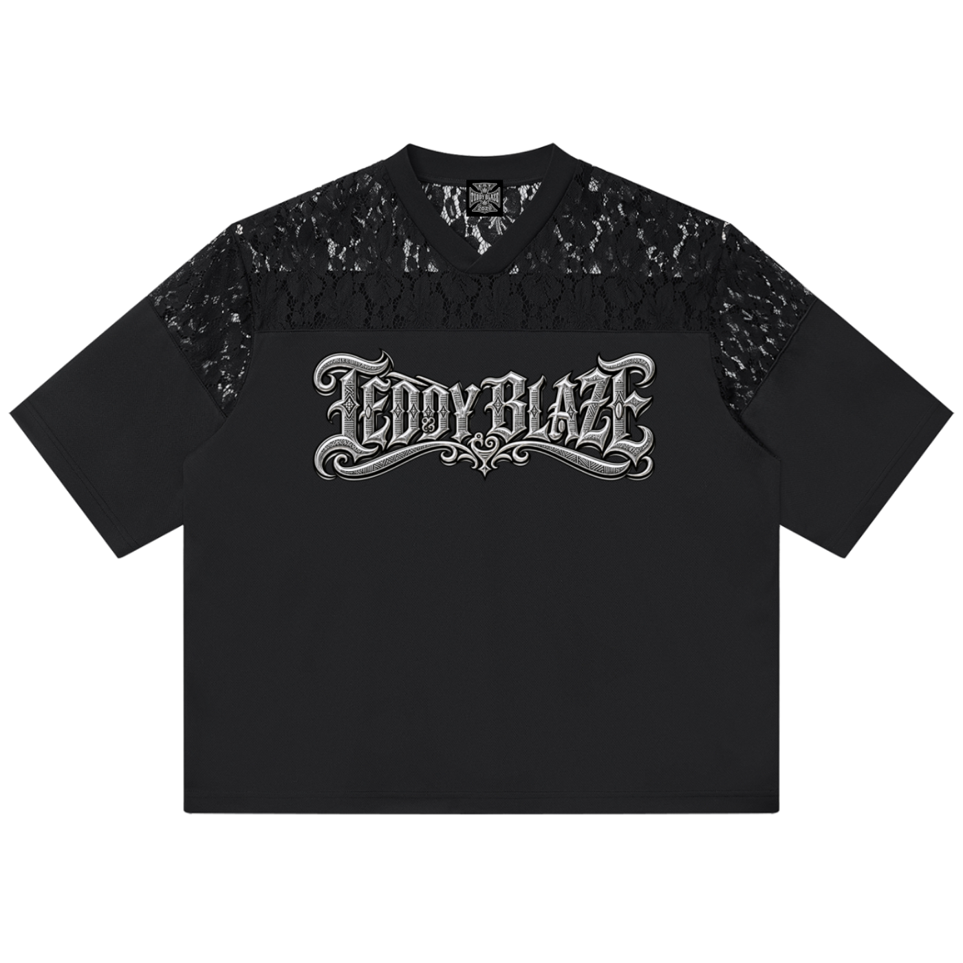 A black short-sleeve t-shirt with a sheer black lace yoke across the shoulders and upper chest, featuring a stylized silver 'TEDDY BLAZE' graphic printed across the chest, shown flat on a white background.