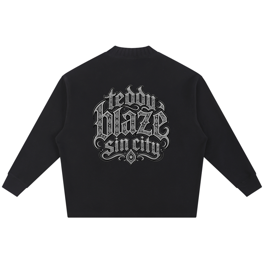 Elevate your knitwear with the Teddy Blaze Sin City Sacred Ribbed Knit Jumper. Black ribbed cotton-poly knit, praying hands chest graphic, and ornate Sin City back print. Shop NYC to Vegas style
