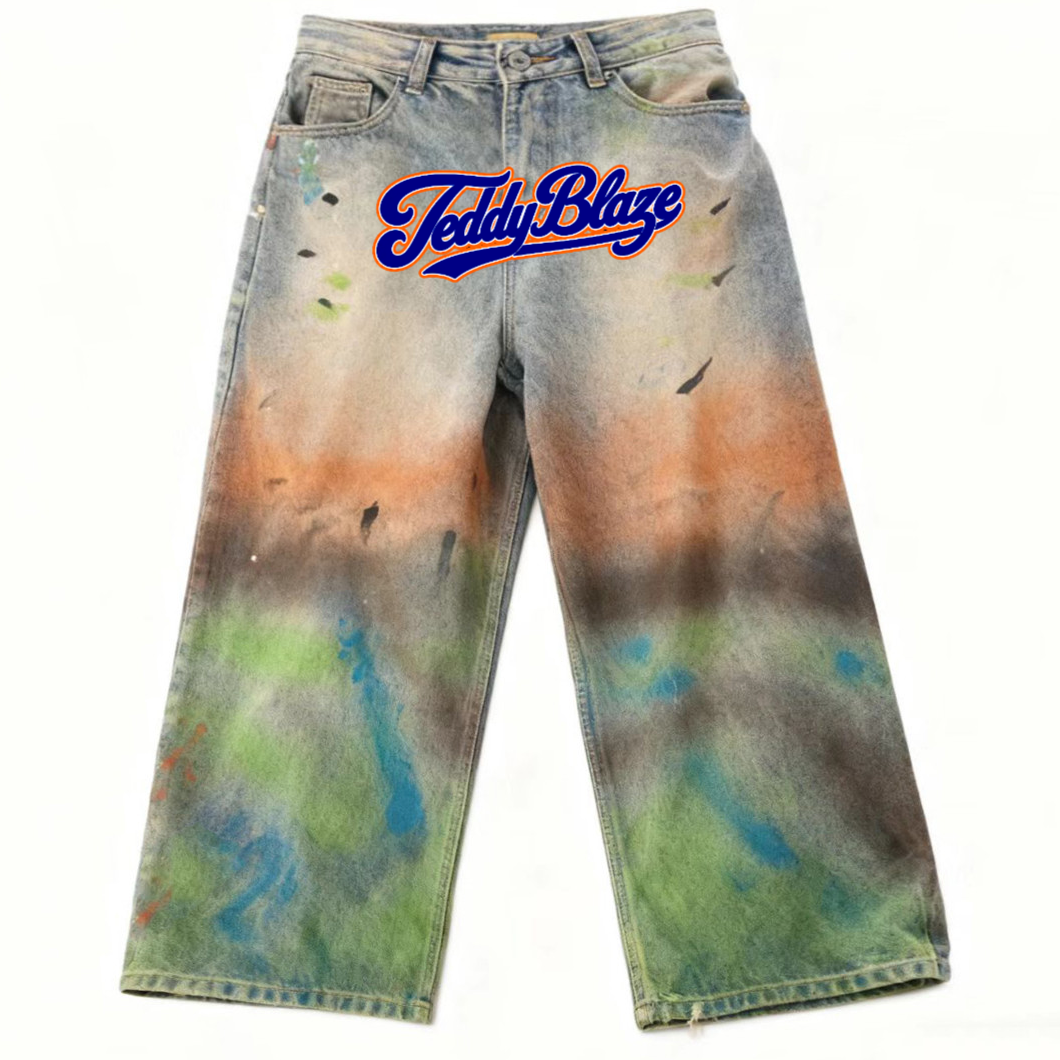Oversized wide-leg denim jeans with paint-wash effect, bold Signature front graphic, cotton-blend fabric, and BK Collection streetwear energy.
