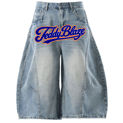 Oversized wide leg denim jorts with a bold Signature front graphic, washed 100% cotton denim, and BK Collection streetwear energy.