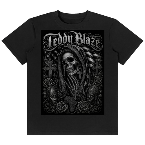 A black short-sleeve crewneck t-shirt featuring a large black and white graphic print on the front. The graphic displays the text 'Teddy Blaze' in a gothic font above a detailed illustration of a hooded skull surrounded by roses, crosses, and an American flag.