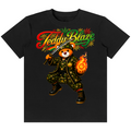 A black short-sleeve crewneck t-shirt featuring a graphic of a red panda in a military uniform with a sword and a burning flame, under the text 'Teddy Blaze' in a red, yellow, and green Rastafarian-style font.