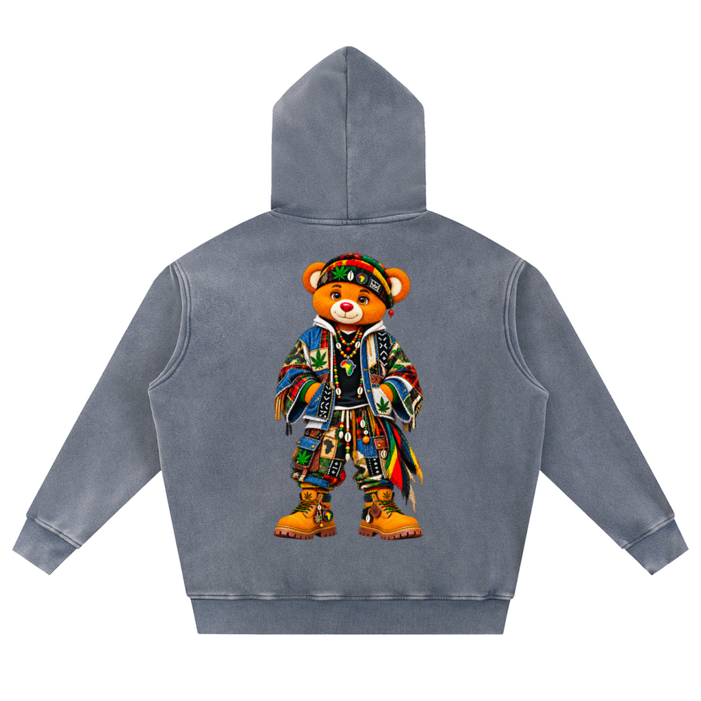 A gray hooded sweatshirt shown from the back, featuring a large graphic of a teddy bear dressed in a colorful, patterned outfit with boots and a hat.