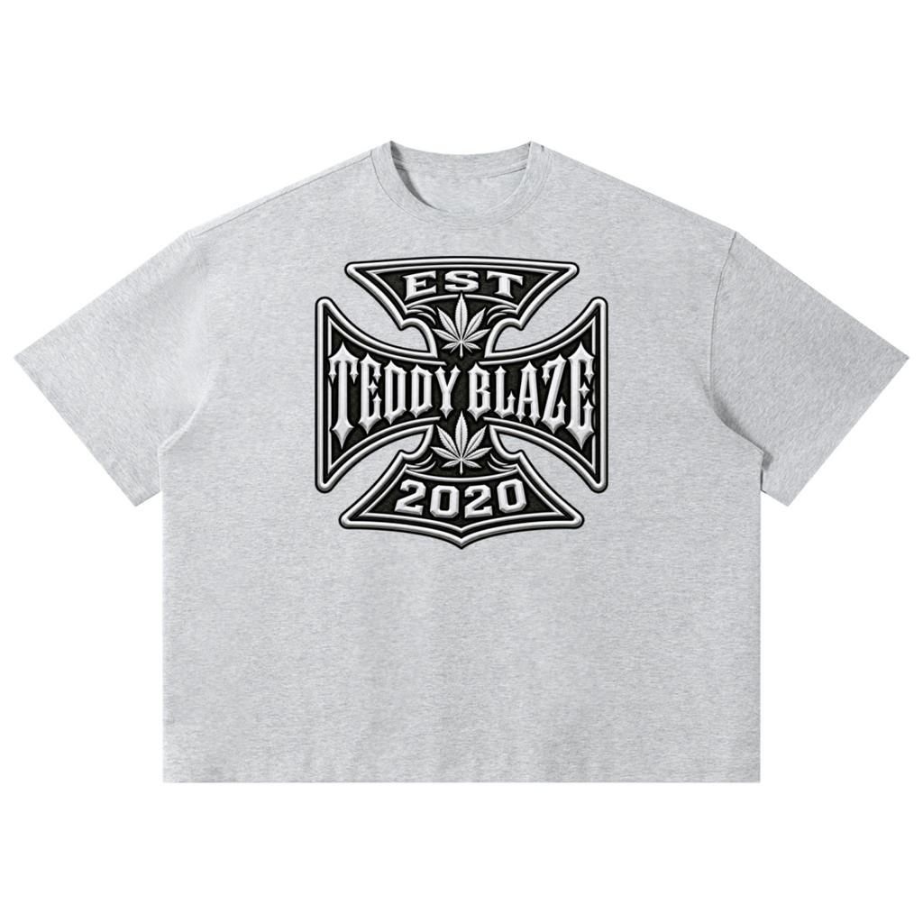 Shop the DaCruz Boxy Tee by Teddy Blaze. 220 GSM cotton-poly oversized drop-shoulder t-shirt with iron cross gothic emblem from TOPS BY TEDDY BLAZE.