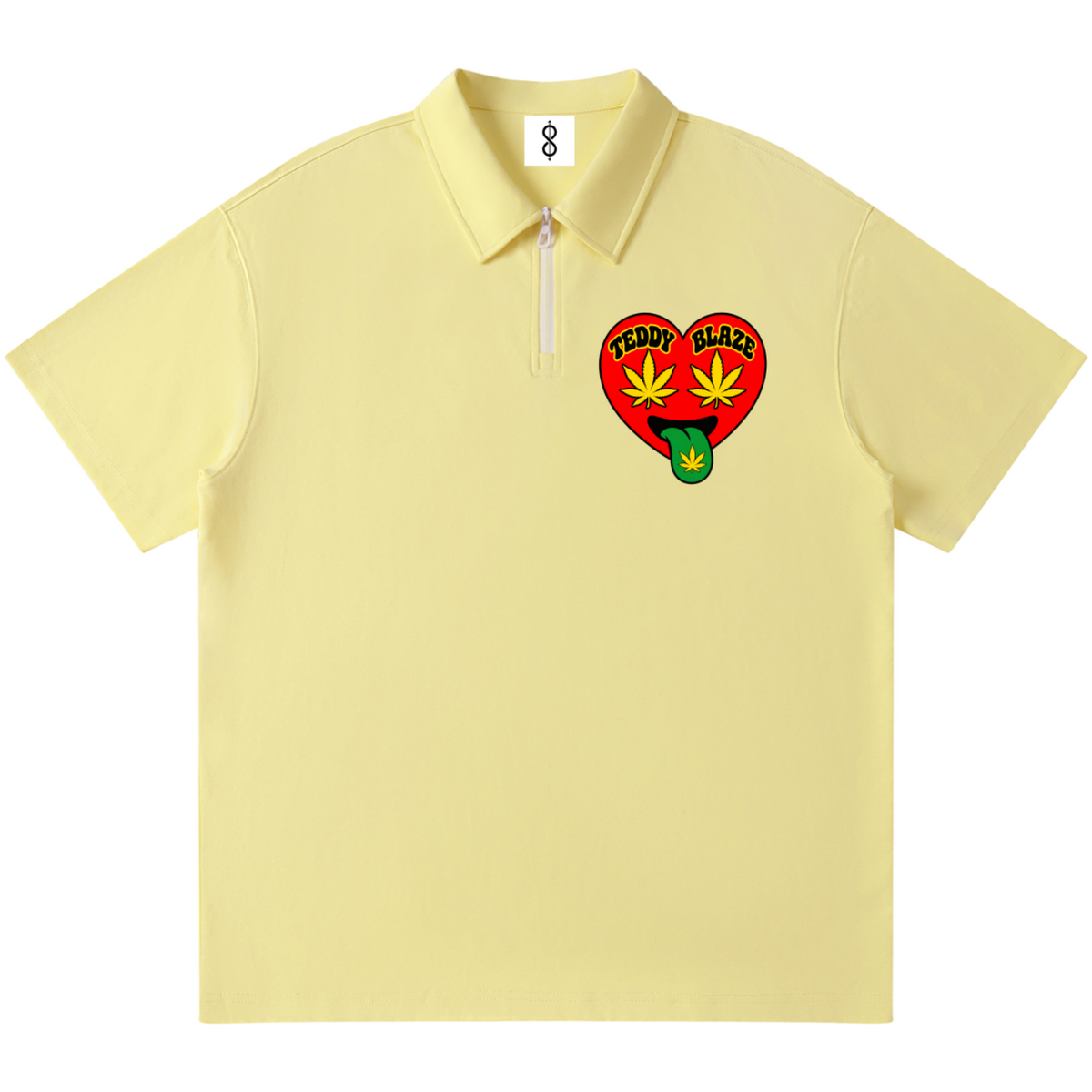 A pale yellow short-sleeve polo shirt with a half-zip collar and a red heart-shaped chest graphic featuring green and yellow details, displayed on a solid white background.
