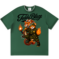 A dark green short-sleeve t-shirt with a graphic of a panda dressed in a samurai warrior outfit, holding a sword and flaming orbs, with the text 'Teddy Blaze' printed above. The t-shirt is displayed flat against a plain white background.