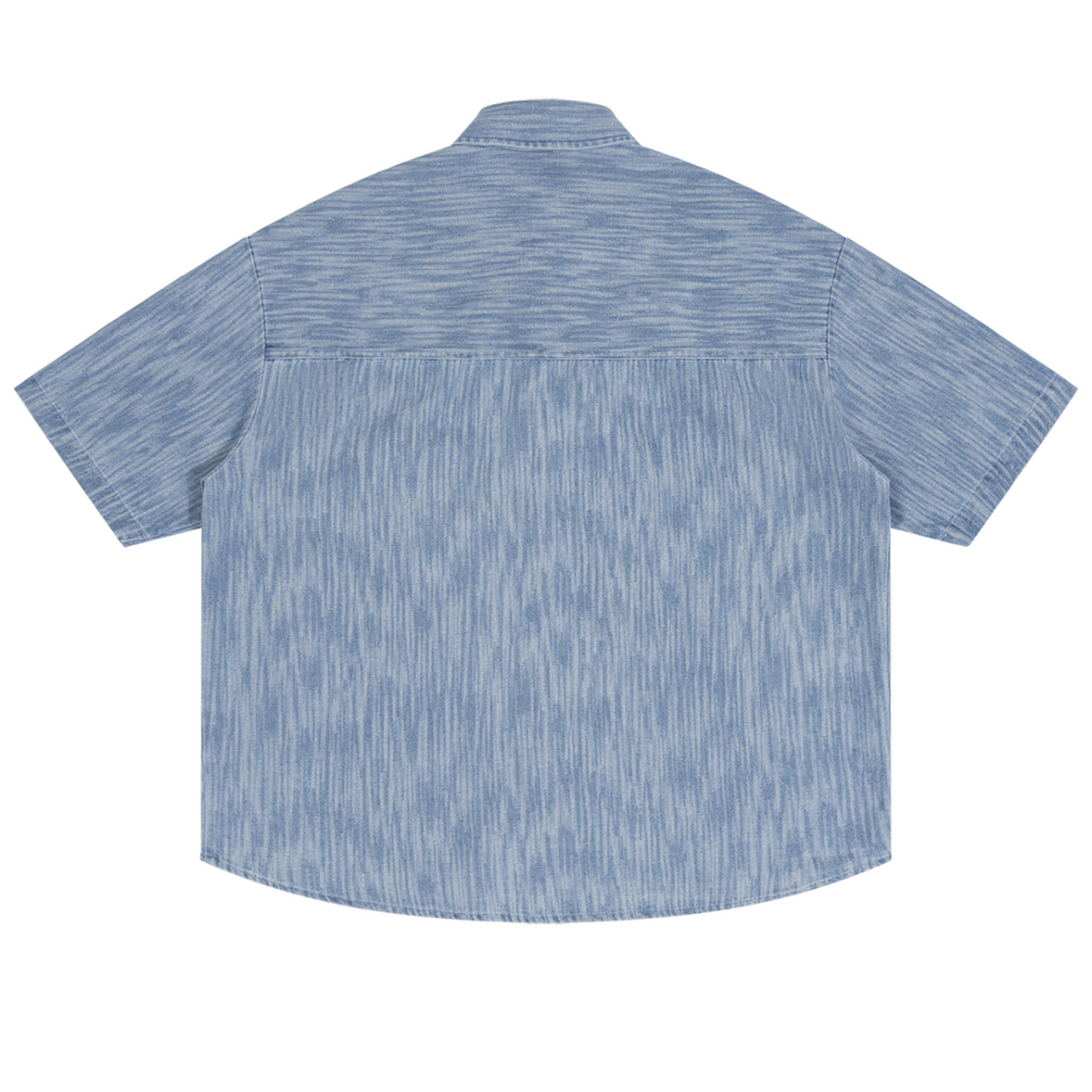 Shop the Signature Boxy Vintage Wash Denim Camp Shirt by Teddy Blaze. Lightweight 230 GSM blue striated denim short sleeve button-up from THE BLAZE MAN.