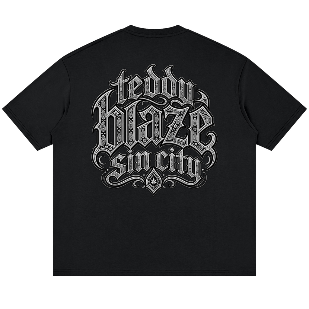 Elevate your streetwear with the Teddy Blaze Sin City Drop Shoulder Cotton Tee. Black cotton, tattoo praying hands print, and Sin City back graphic. Shop NYC to Vegas style.