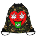 A black drawstring backpack featuring a camouflage pattern with green and tan cannabis leaves, decorated with a large red heart graphic on the front that has white leaf eyes and a green tongue with a white leaf.