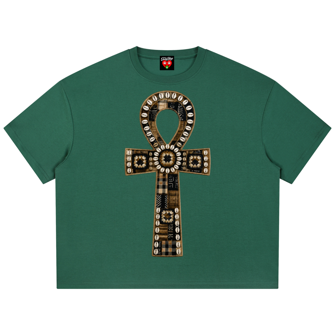 A green short-sleeve crop top t-shirt featuring a large central graphic of an ankh symbol made from plaid and patterned fabrics with circular details.