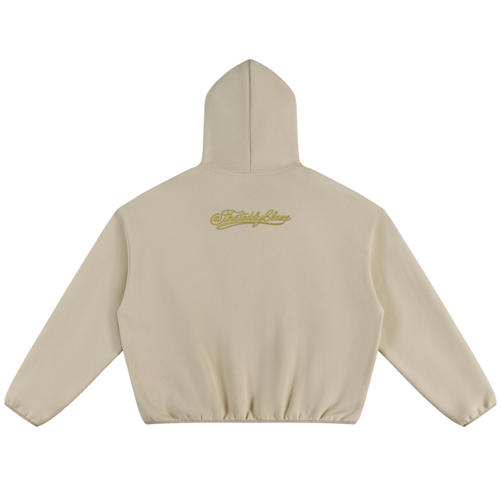 Shop the Signature Bearfather of Vegas Boxy Piping Detail Fleece Hooded Jumper by Teddy Blaze. 350 GSM sand fleece hoodie featuring contrast piping and brand personification The Bearfather.