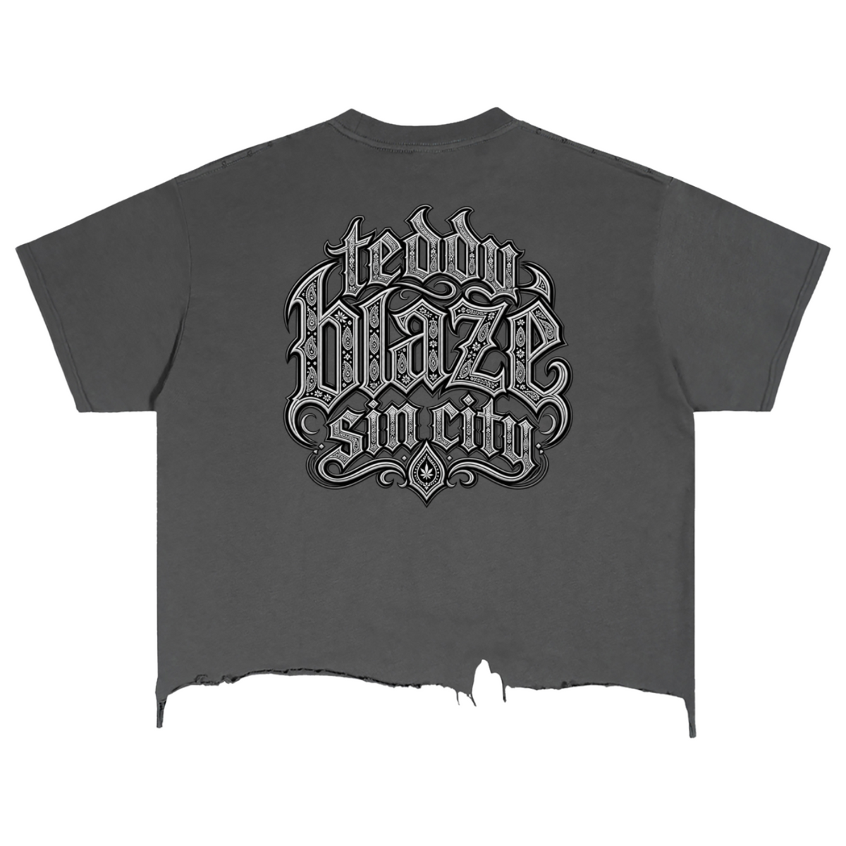 Elevate your distressed streetwear with the Teddy Blaze Sin City Sacred Vintage Wash Distressed Hem Tee. Charcoal gray cotton, frayed raw hem, and tattoo praying hands graphic. Shop NYC to Vegas style.