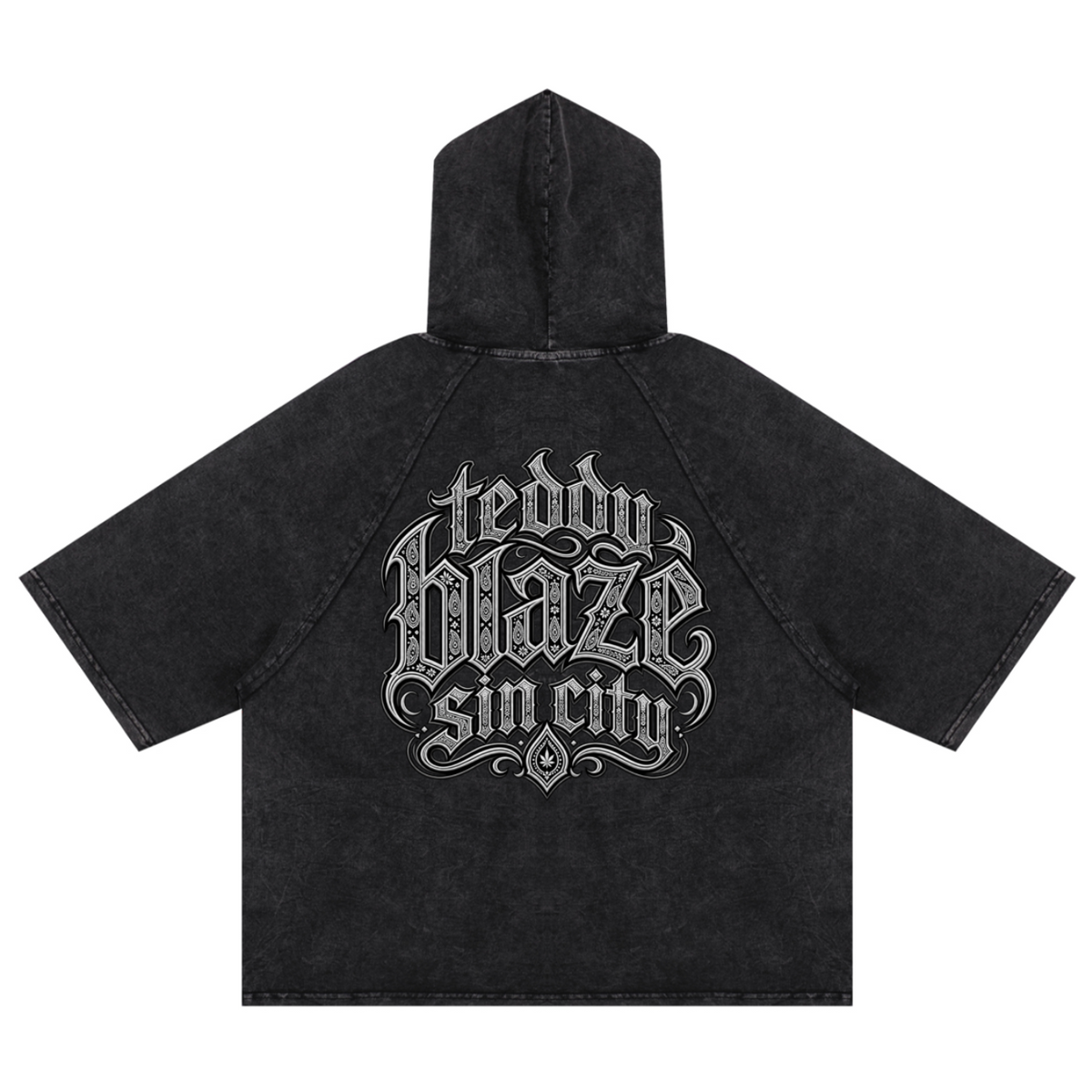Elevate your casualwear with the Teddy Blaze Sin City Snow Washed Hooded Box Cut Tee. Charcoal snow-washed cotton blend, short raglan sleeves, hood, and tattoo praying hands graphic. Shop NYC to Vegas style.