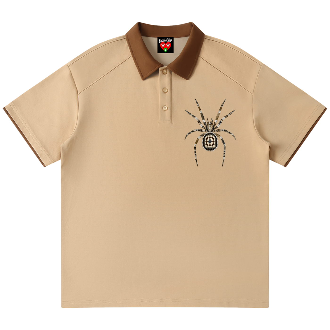 A beige short-sleeve polo shirt with a brown collar and sleeve trim, featuring a black spider graphic on the left chest. The shirt is displayed flat against a solid white background.