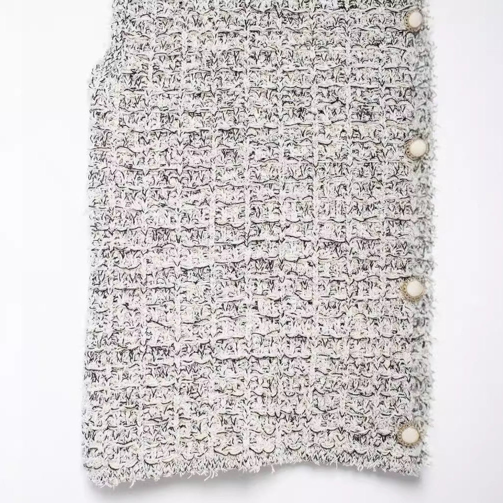 Shop the Bouclé Tweed Sleeveless Vest by Teddy Blaze. Single-breasted lapel vest featuring pearl buttons and textured bouclé tweed from THE IVY WOMAN collection.