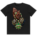 A black short-sleeve crewneck t-shirt featuring a detailed graphic print of a praying hand adorned with a green cannabis leaf medallion, gold rings, and a large green and gold 'TEDDY BLAZE' marijuana leaf pendant.