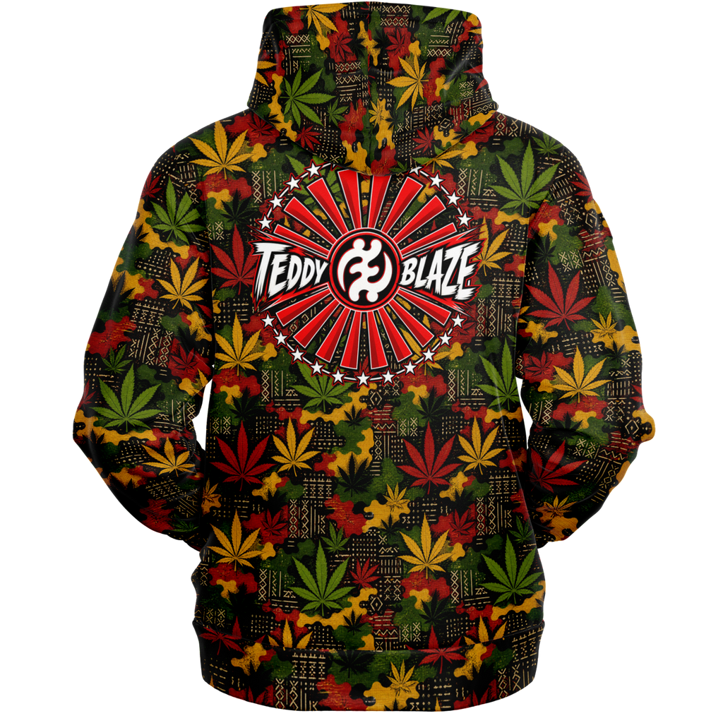 Shop the Teddy Blaze Mud Carnival Hooded Jumper featuring mudcloth-inspired geometry, cannabis leaves, RiGBY camouflage and a bold Teddy Blaze Rising back graphic.