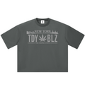 A dark gray crewneck t-shirt with a light gray graphic on the chest that reads 'NEW YORK TDY BLZ THE EMPIRE STATE' with a cannabis leaf in the center, displayed on a solid white background.