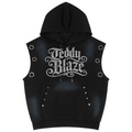 A black sleeveless hooded vest with a front kangaroo pocket, featuring a large silver glittery 'Teddy Blaze' logo on the chest, side eyelets, and silver studs, shown against a plain white background.