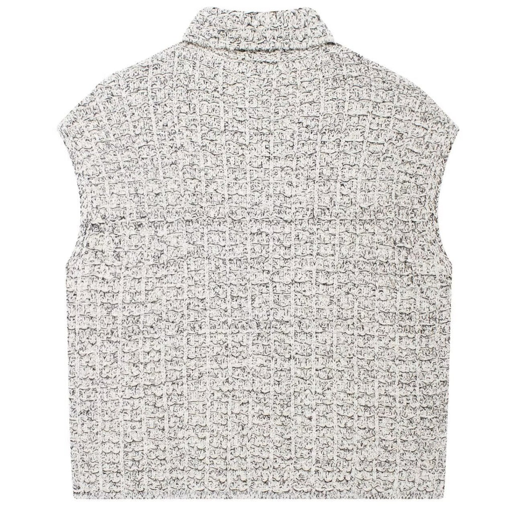 Shop the Bouclé Tweed Sleeveless Vest by Teddy Blaze. Single-breasted lapel vest featuring pearl buttons and textured bouclé tweed from THE IVY WOMAN collection.