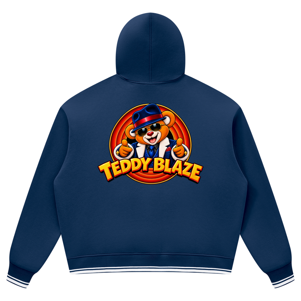Elevate your preppy streetwear layers with the House of Teddy Blaze Mr Blaze Striped Trim Fleece Hoodie. Navy blue 345 gsm fleece, striped ribbed trim, kangaroo pocket, and suit-and-fedora bear graphics. Shop NYC to Vegas style.