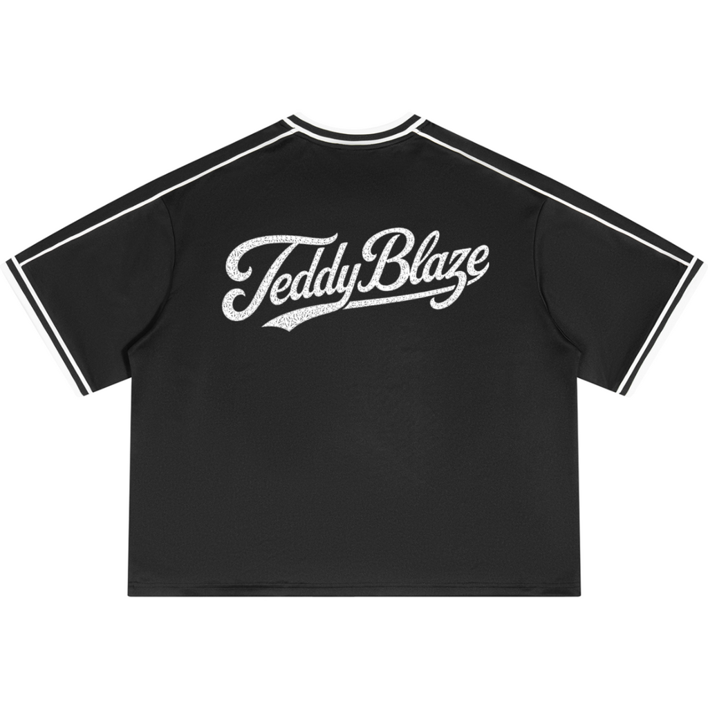 A black short-sleeve t-shirt with white contrast stitching along the collar and sleeve cuffs, featuring a distressed white 'TeddyBlaze' logo printed across the chest.