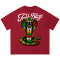 A red short-sleeve crewneck t-shirt featuring a large graphic of a hooded cobra snake with cannabis leaves in its scales, under the white script text 'Teddy Blaze'.