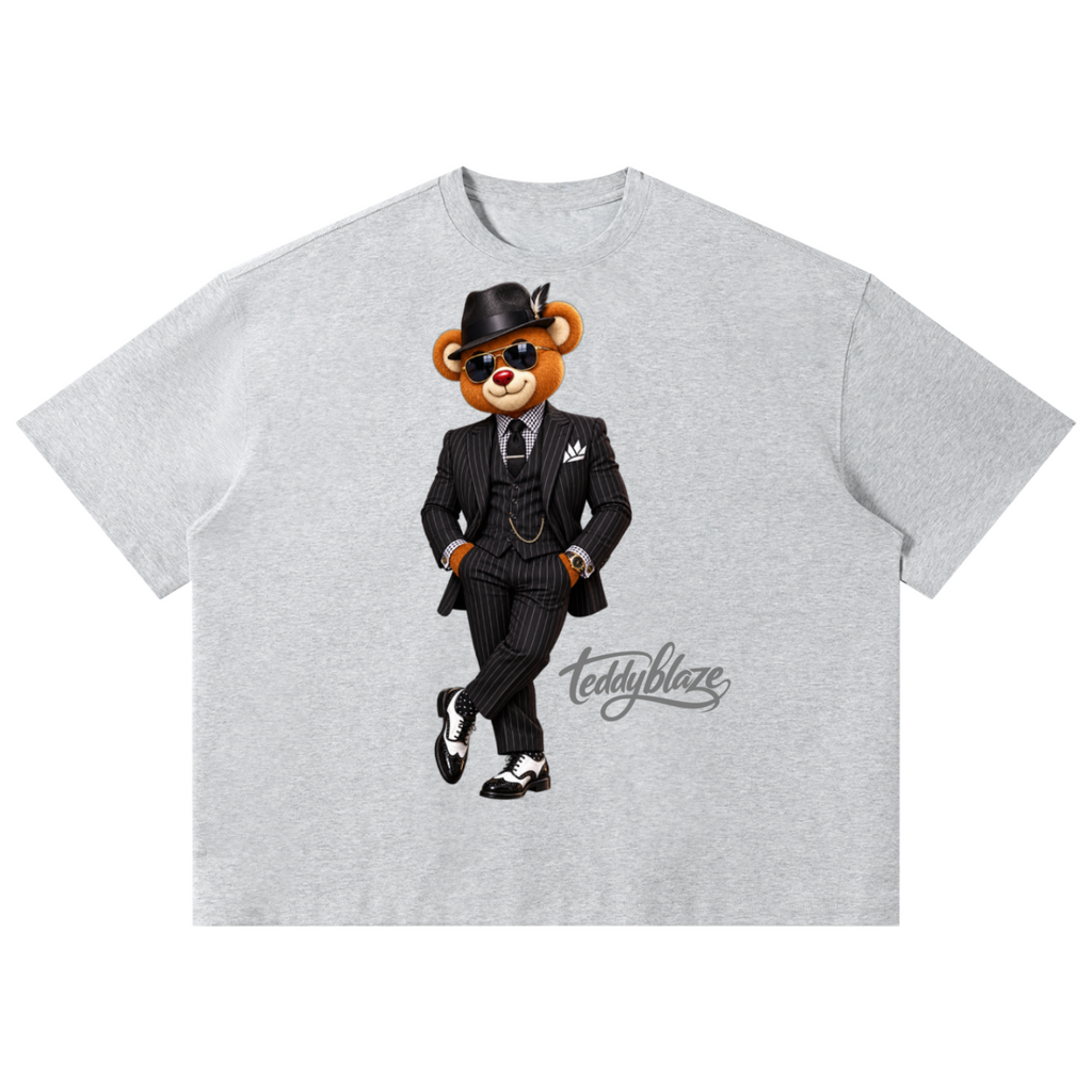 Shop the Dapper Blaze Boxy Tee by Teddy Blaze. 220 GSM cotton-poly oversized drop-shoulder t-shirt with pinstripe-suited bear graphic from TOPS BY TEDDY BLAZE.