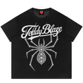 A black short-sleeve t-shirt with a white graphic print featuring the text 'Teddy Blaze' in a stylized font and a large spider design made of small diamond-like shapes, shown on a plain white background.