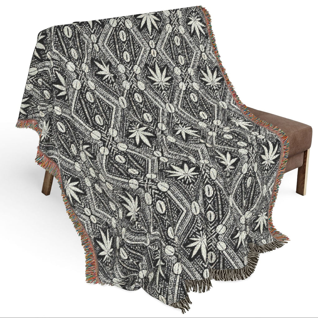 Patterned blanket draped over a chair on a white background
