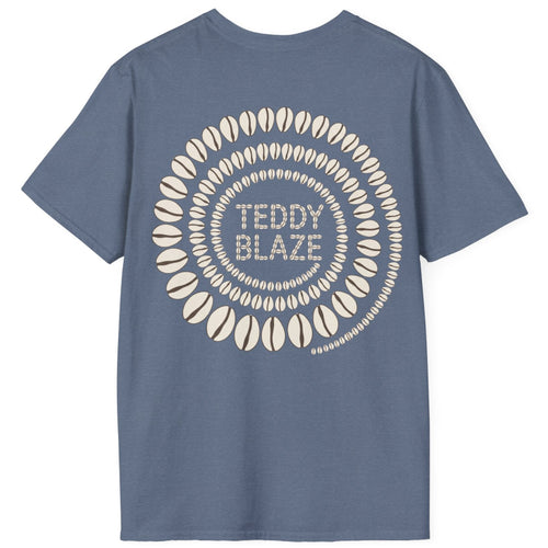 A slate blue short-sleeve t-shirt with a circular graphic on the back featuring the text 'TEDDY BLAZE' in the center surrounded by concentric rings of stylized surfboards, shown on a plain white background.