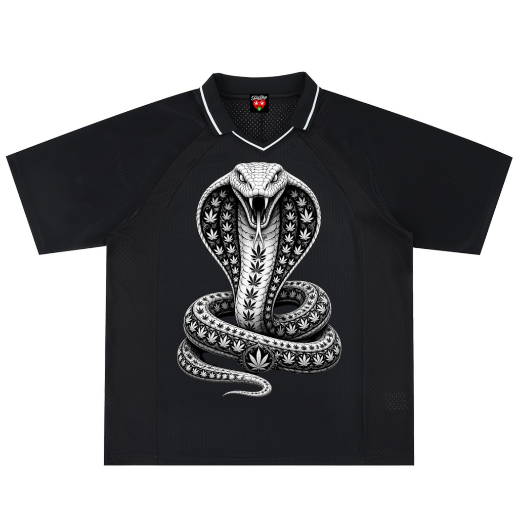 A black short-sleeve polo shirt featuring a large white and gray graphic of a cobra snake coiled in the center, with a white collar trim and a small red logo on the inner neck label.