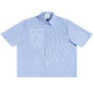 A light blue and white vertically striped short-sleeve button-up shirt with a white line-art graphic of a stylized face on the left chest, displayed flat against a white background.