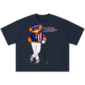 A dark navy blue short-sleeve t-shirt with a graphic of a cartoon bear wearing a baseball uniform and sunglasses, holding a golf club, with a stylized 'The Fly' logo printed on the chest.