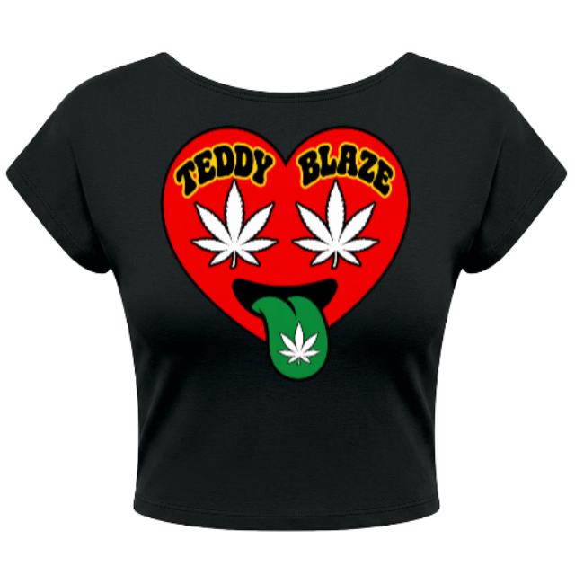 A black short-sleeve crop top featuring a red heart graphic on the front with the words 'TEDDY BLAZE' in yellow, two white cannabis leaves, and a green tongue with a cannabis leaf.