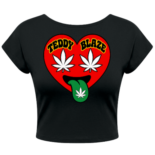 A black short-sleeve crop top featuring a red heart graphic on the front with the words 'TEDDY BLAZE' in yellow, two white cannabis leaves, and a green tongue with a cannabis leaf.