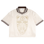 An off-white short-sleeve V-neck jersey with a gold tribal face graphic on the front, featuring dark brown and white striped trim on the collar and cuffs.