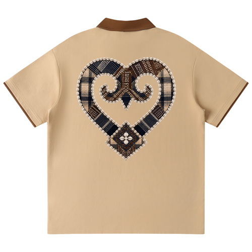 A beige short-sleeve polo shirt shown from the back, featuring a large heart-shaped patchwork graphic in navy, brown, and beige plaid patterns on the back, with a contrasting brown collar.