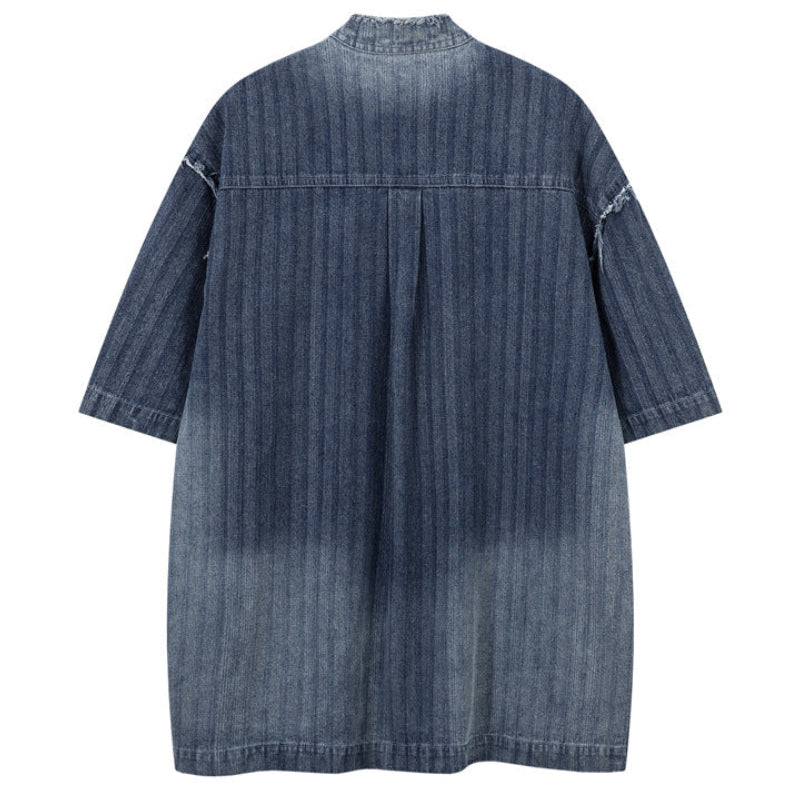 Shop the Iron + Ivy Distressed Denim Stand Collar Short Sleeve Shirt by Teddy Blaze. Oversized indigo short-sleeve denim shirt featuring raw frayed collars, self-striping, and metal snap hardware.
