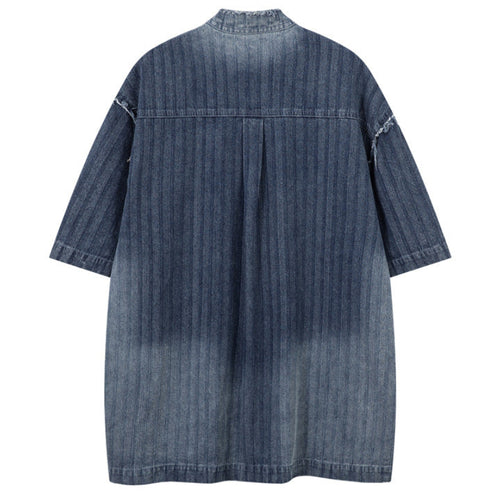 Shop the Iron + Ivy Distressed Denim Stand Collar Short Sleeve Shirt by Teddy Blaze. Oversized indigo short-sleeve denim shirt featuring raw frayed collars, self-striping, and metal snap hardware.