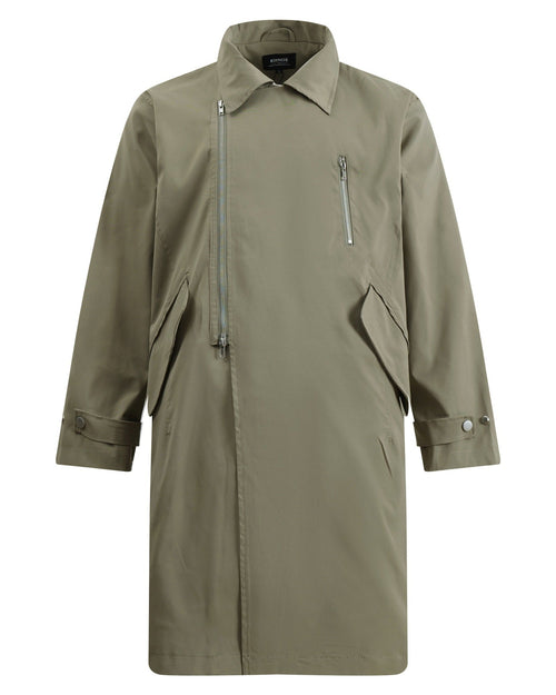Discover the Teddy Blaze green asymmetric zip trench coat. Featuring a bold diagonal front zipper, turn-down collar, structured flap pockets, and a relaxed longline silhouette, this piece delivers architectural edge for transitional weather.