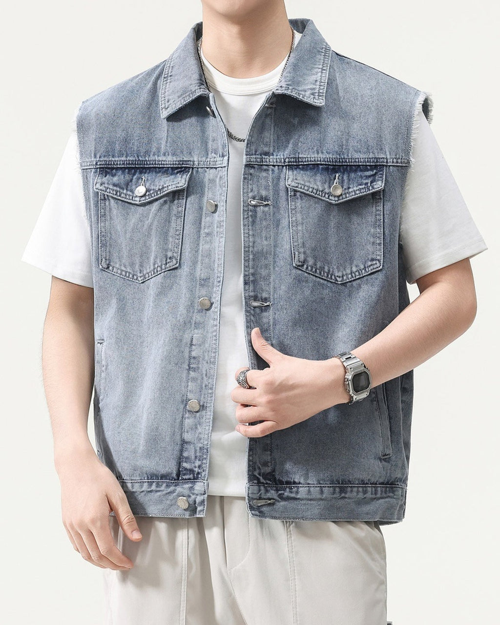 Shop the Urban Workwear Raw-Edge Denim Vest by Teddy Blaze. Loose fit cotton-blend utility vest featuring frayed armholes, multi-pocket storage, and turn-down collar.