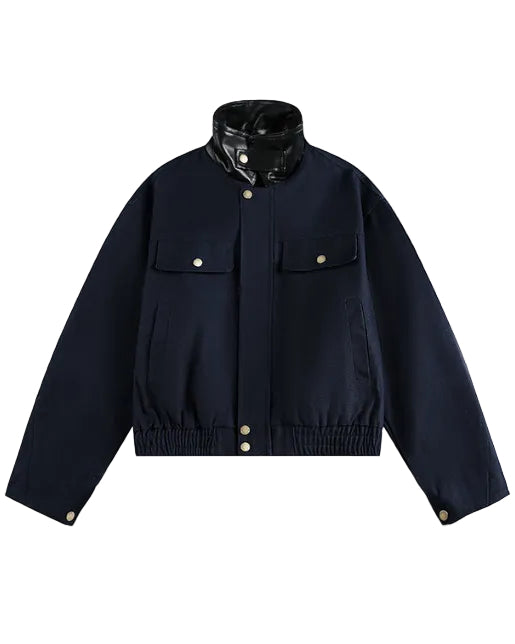 Discover the Teddy Blaze cotton bomber jacket featuring a contrasting black faux-leather stand collar. Available in beige and dark blue colorways, this piece blends structured utility with modern street-luxury styling.