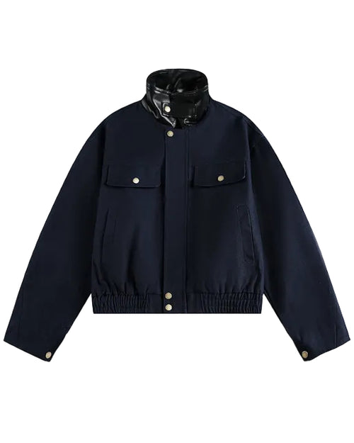 Discover the Teddy Blaze cotton bomber jacket featuring a contrasting black faux-leather stand collar. Available in beige and dark blue colorways, this piece blends structured utility with modern street-luxury styling.