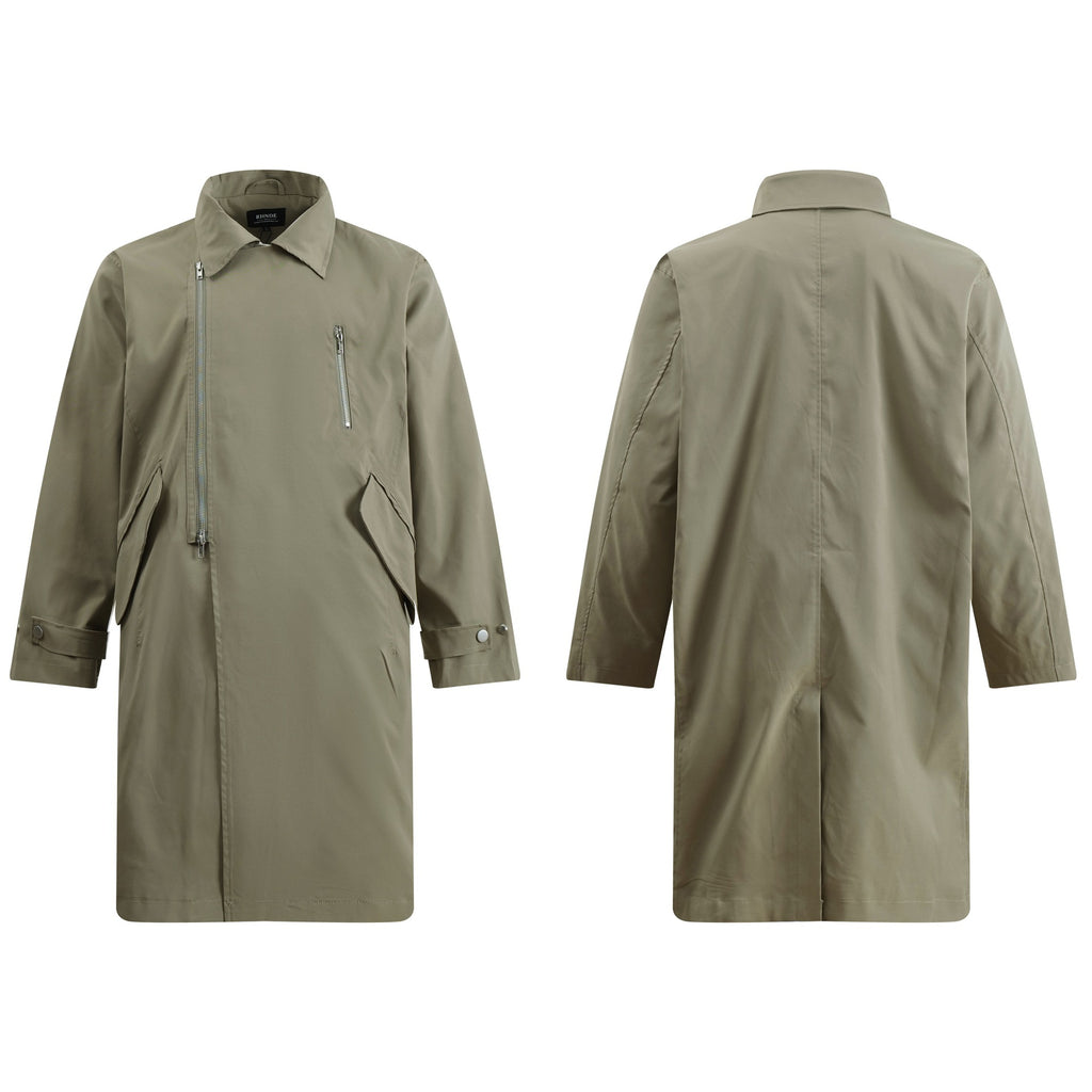Discover the Teddy Blaze green asymmetric zip trench coat. Featuring a bold diagonal front zipper, turn-down collar, structured flap pockets, and a relaxed longline silhouette, this piece delivers architectural edge for transitional weather.