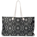 Travel with DaChek™. This oversized Teddy Blaze Weekender features bold black-and-white African-inspired patternwork, cotton rope handles, a lined interior and spacious T-bottom construction.