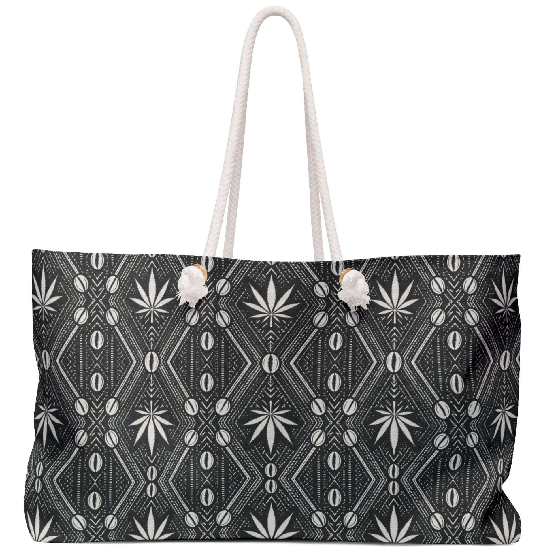 Travel with DaChek™. This oversized Teddy Blaze Weekender features bold black-and-white African-inspired patternwork, cotton rope handles, a lined interior and spacious T-bottom construction.