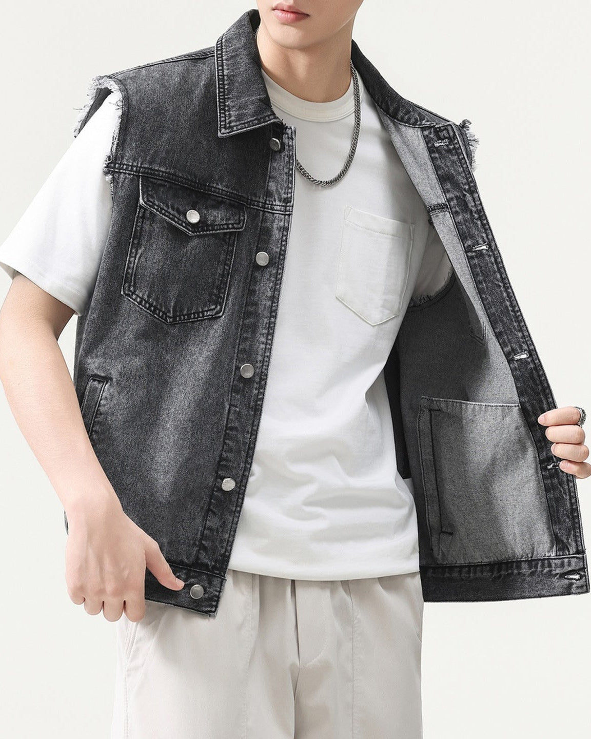 Shop the Urban Workwear Raw-Edge Denim Vest by Teddy Blaze. Loose fit cotton-blend utility vest featuring frayed armholes, multi-pocket storage, and turn-down collar.