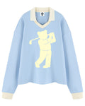 Shop the Iron + Ivy Signature Golfer Contrast Trim Long Polo by Teddy Blaze. Heavyweight 320 GSM sky blue cotton-poly long-sleeve polo with cream contrast collar, cuffs, and signature bear golfer graphics.