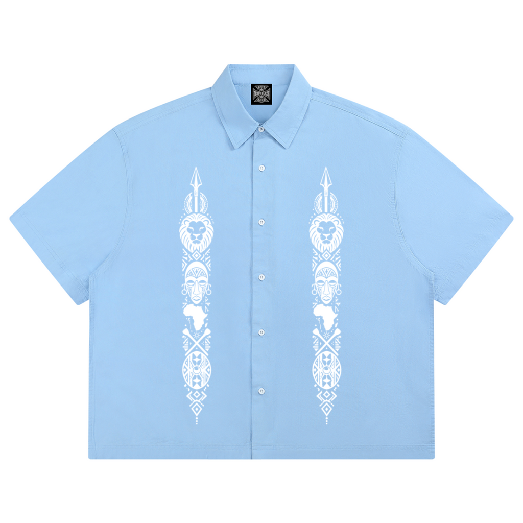 Powder-blue 100% cotton boxy Cubano shirt with twin Afrodemia graphics, relaxed unisex proportions and signature VERY TEDDY back branding.